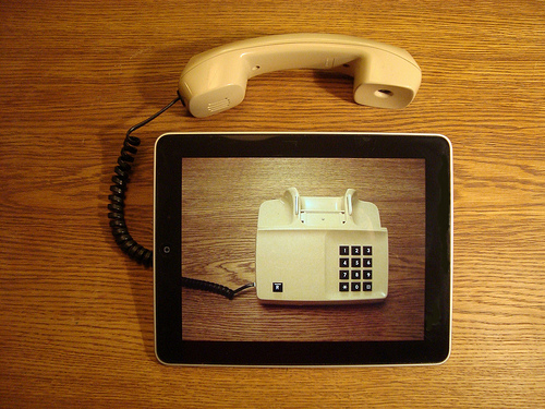 An old phone on the screen of an iPad.